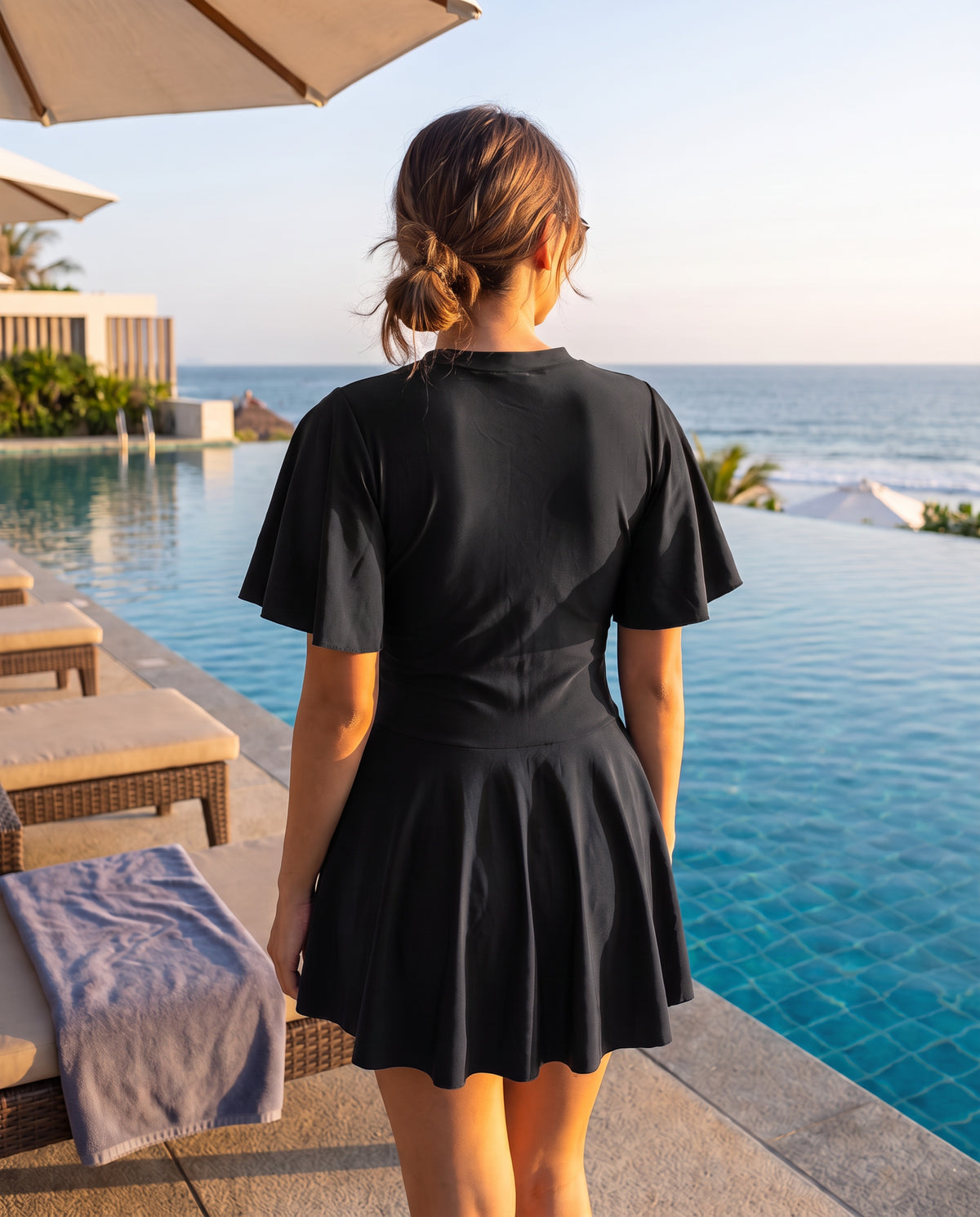 ZipMAE Swimwear Midnight Bliss short sleeve top with a sleek black design and comfortable fit, perfect for swimming or casual wear.