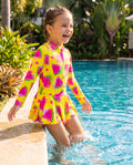 Colorful Melon Mania swimwear from ZipMAE Swimwear featuring bright, tropical-inspired patterns on a stylish one-piece swimsuit.