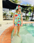ZipMAE Swimwear Sun Hat Tropical Twist with wide brim and colorful tropical pattern, perfect for beach or outdoor sun protection.