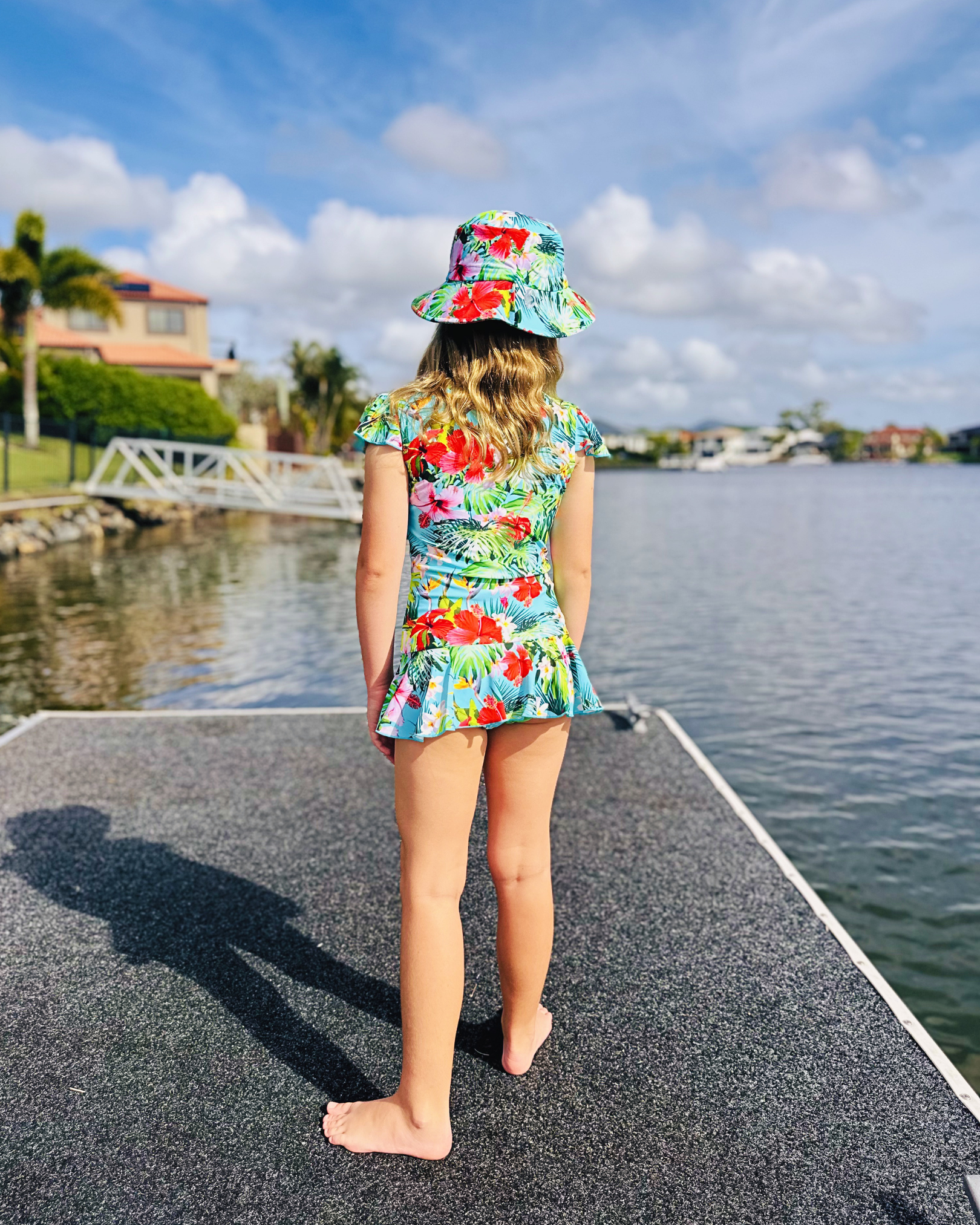 ZipMAE Swimwear tropical twist sun hat with wide brim and colorful pattern, perfect for beach or outdoor sun protection.