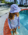 Violet blossom sun hat from ZipMAE Swimwear featuring wide brim and floral design for sun protection and style.