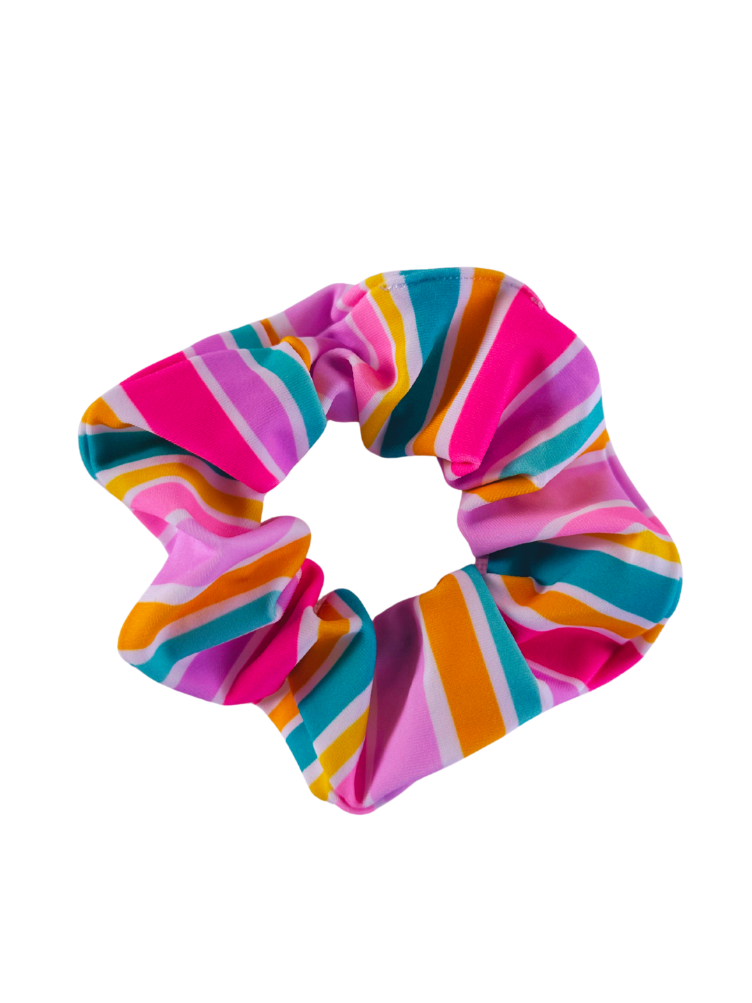 Colorful rainbow scrunchie by ZipMAE Swimwear with soft fabric and elastic band, shown coiled for a stylish hair accessory.